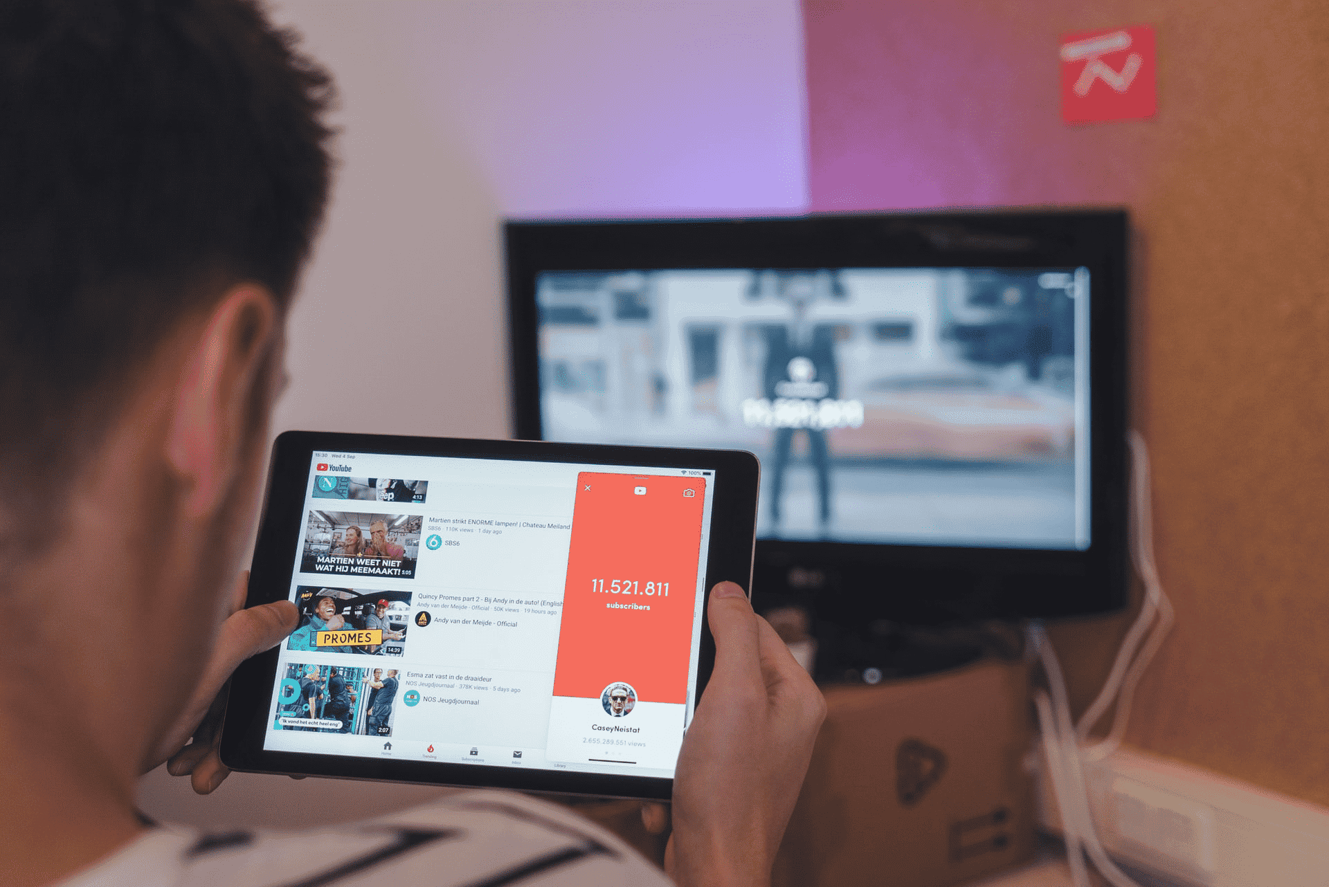 person watching YouTube videos on a tablet